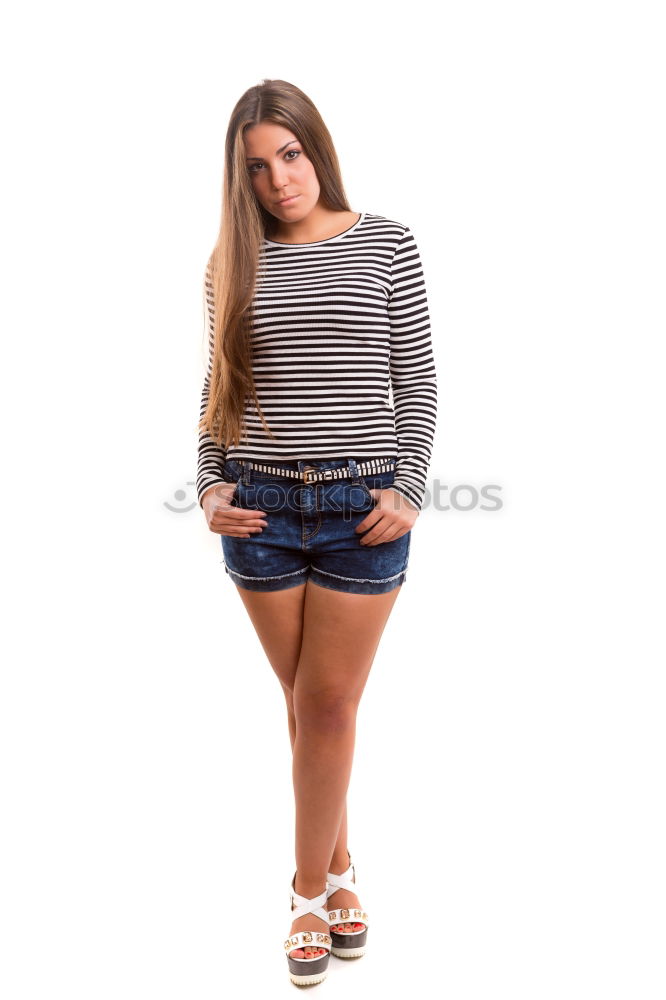 Similar – young redhead woman with curls and freckles stands barefoot in hot pants in front of white door and smiles