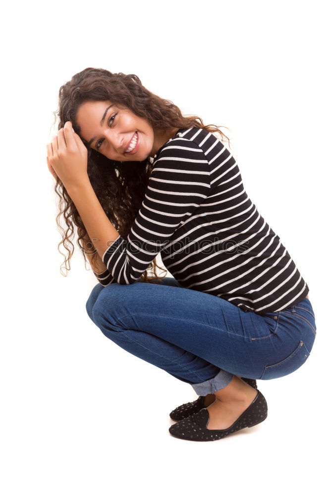 Similar – Image, Stock Photo young, slim, long-legged woman sits on the floor in front of a white wall and covers her face with one hand