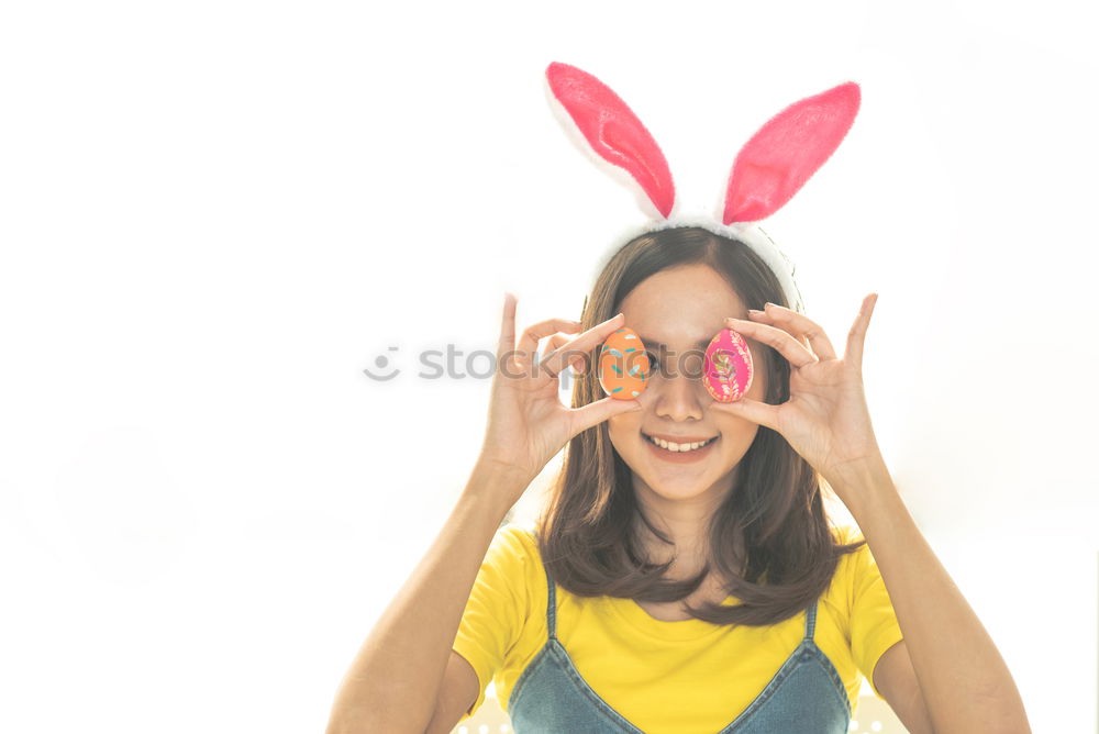 Similar – Back view of a young woman wearing rabbit ears