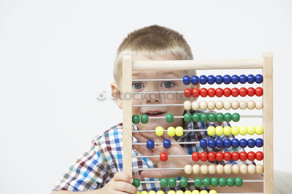 Similar – Boy holding figure on chess board