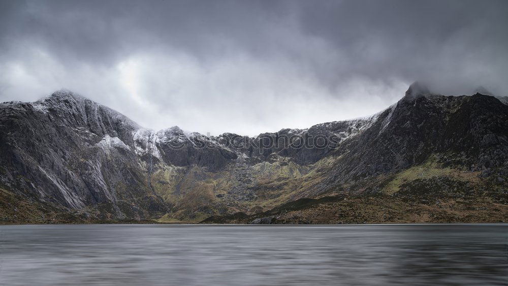 Similar – Rainy atmosphere at the southernmost point of Lofoten with view