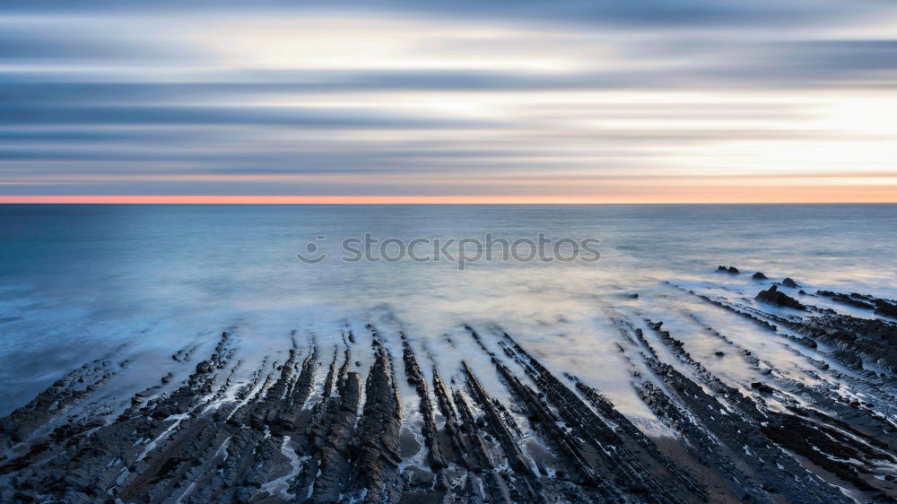 Similar – Image, Stock Photo Sunset mood with rocks on the coast Long time exposure