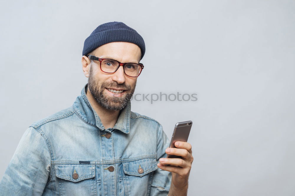 Similar – Image, Stock Photo Portrait of a man with mustache using his smartphone.