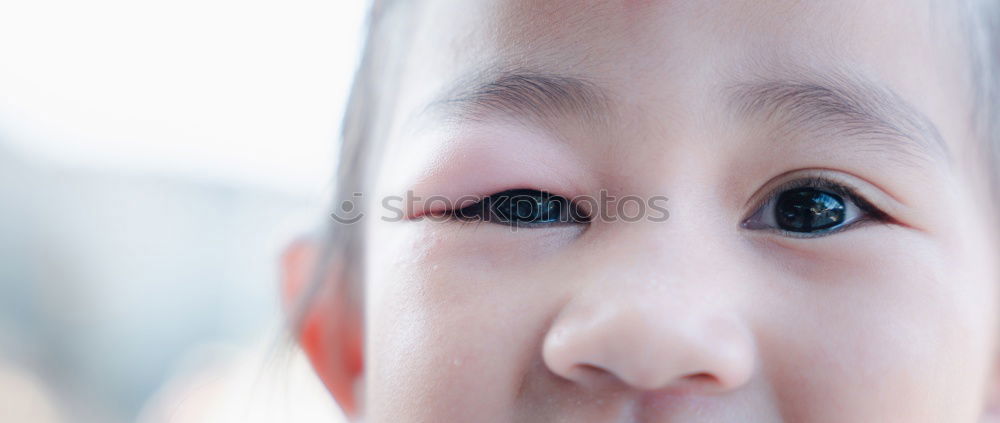 Similar – Baby looks in the mirror and discovers his reflection