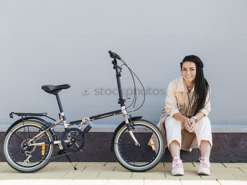 Young woman stands in front of a bus