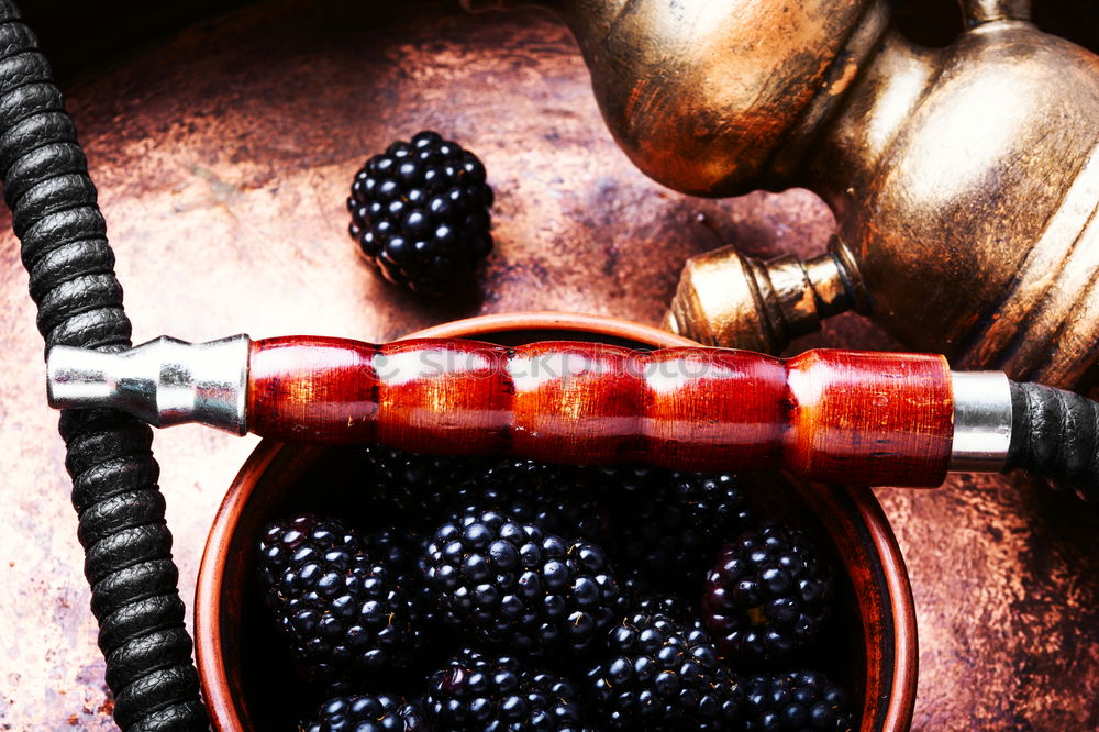 Similar – Stylish oriental shisha with blackberry