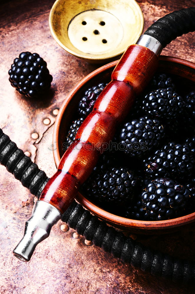 Similar – Stylish oriental shisha with blackberry