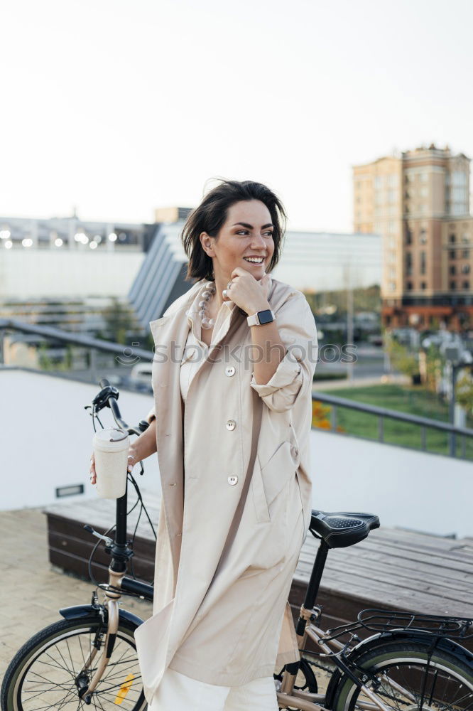 Similar – Young modern hipster riding bike trough urban city while sunset