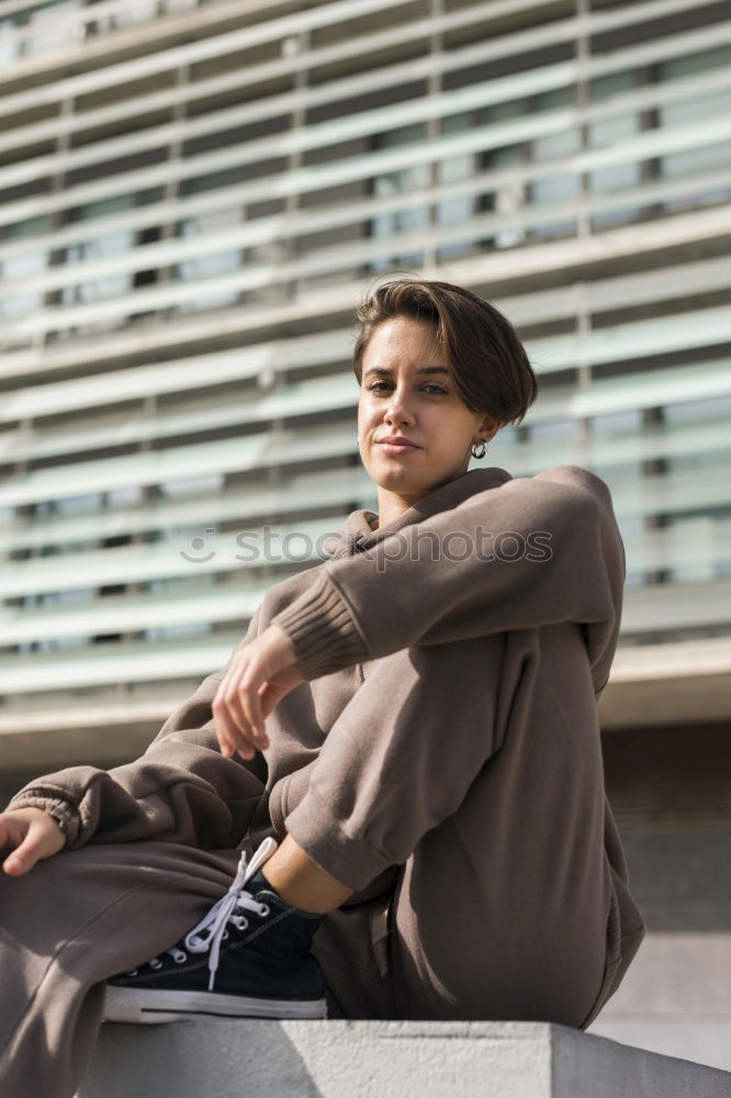 Similar – Attractive businesswoman using smartphone while sitting