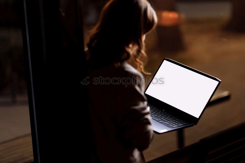 Young man writing in notebook