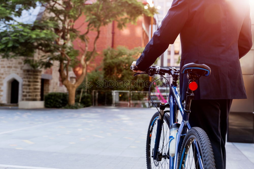 Similar – Young man on bike in the city