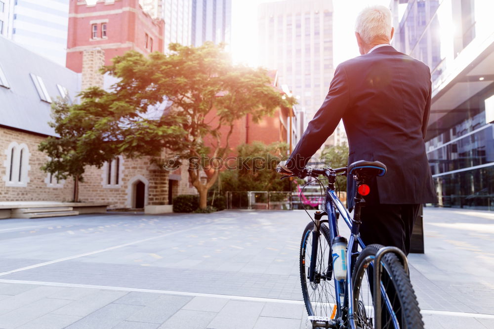 Similar – A young stylish man posing next to his bicycle.