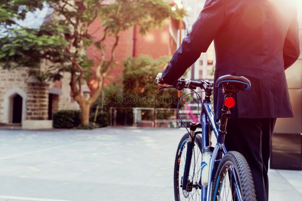 Similar – Young man on bike in the city