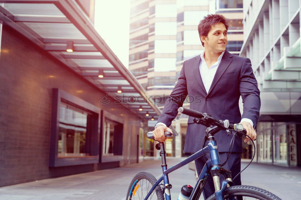 Similar – Man in the street wearing suit near a vintage bicycle.