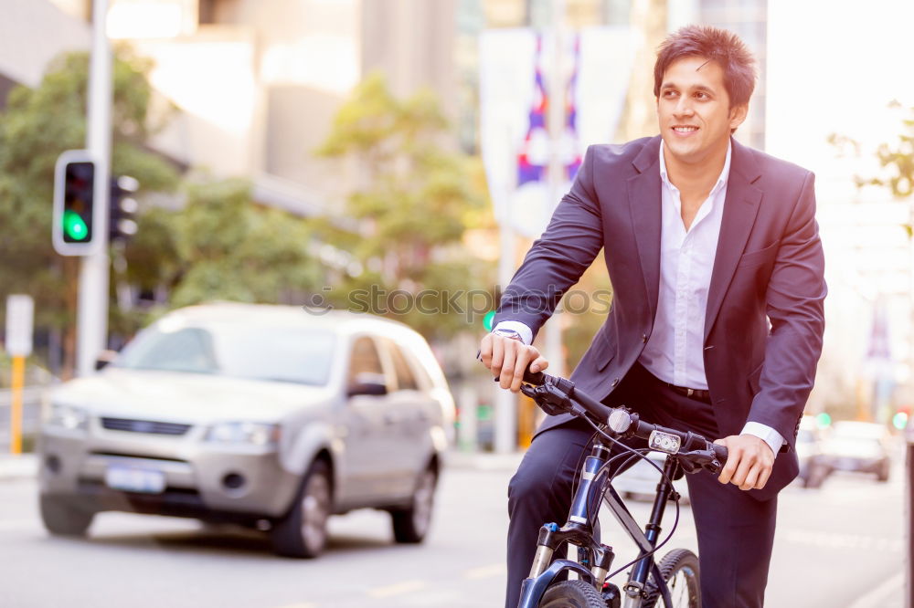 Similar – Man in the street wearing suit near a vintage bicycle.