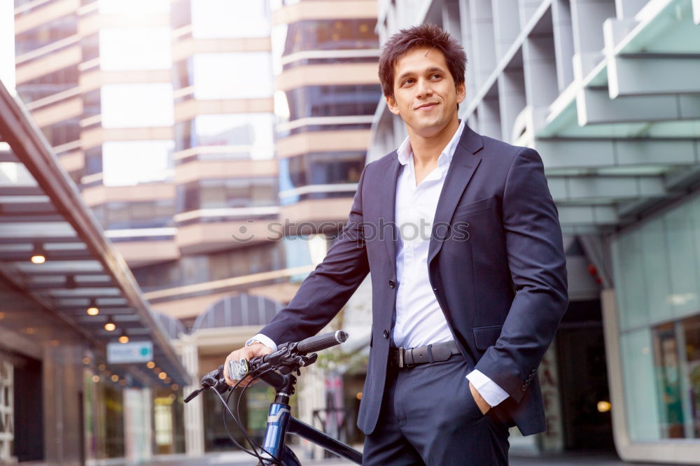 Similar – Man in the street wearing suit near a vintage bicycle.