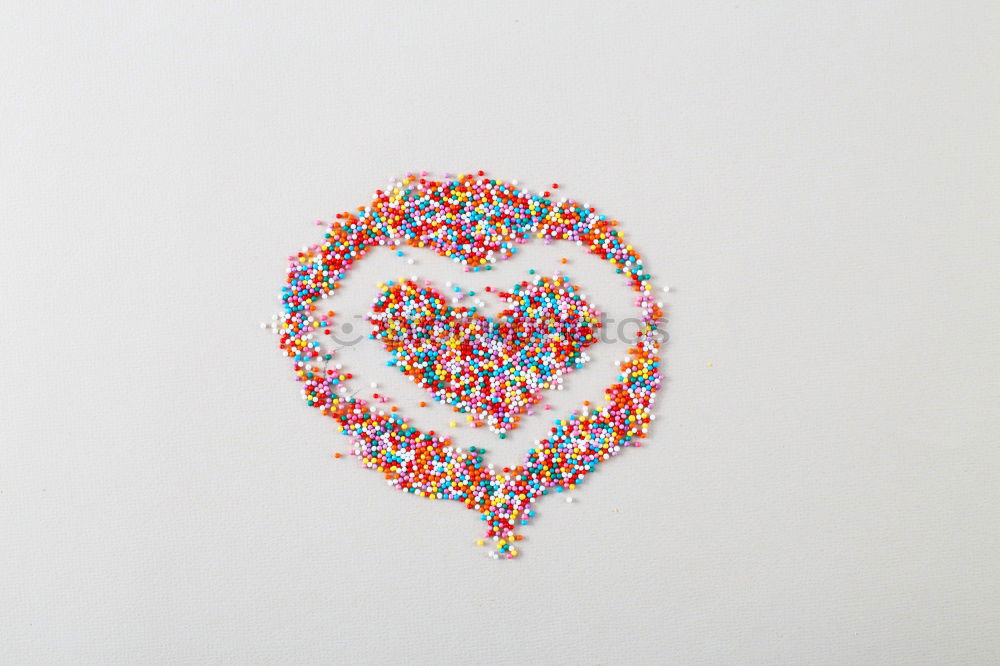 Similar – Image, Stock Photo Number 3 laid out of small chocolate candies with colored sugar sprinkles on white background