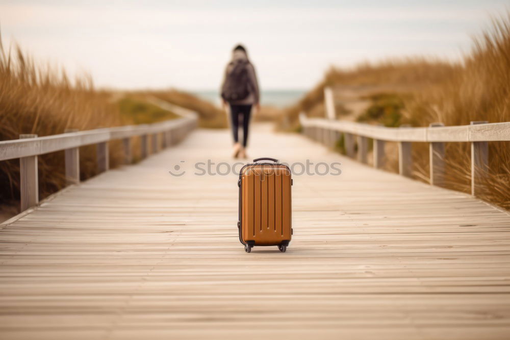 Similar – Boy with suitcase on the road