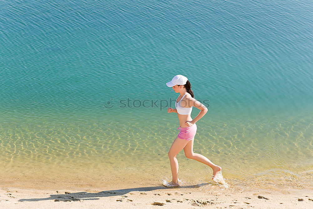 Similar – Playful girl standing in pier near lake