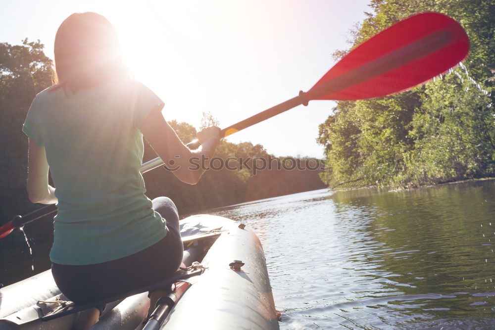 Similar – Unrecognizable woman on kayak exploring river