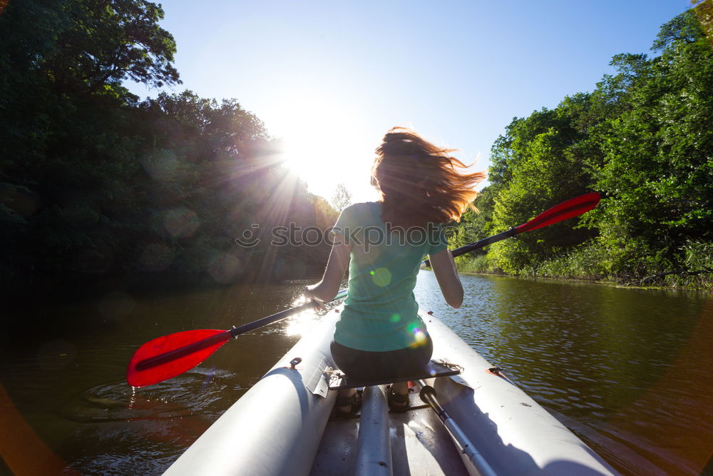 Similar – Unrecognizable woman on kayak exploring river