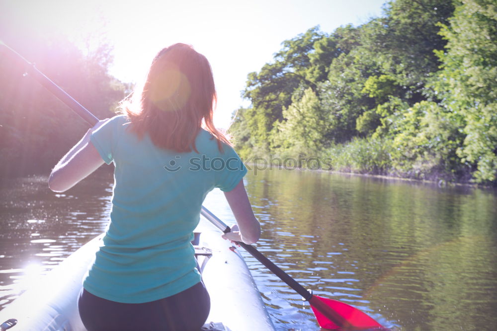 Similar – Unrecognizable woman on kayak exploring river