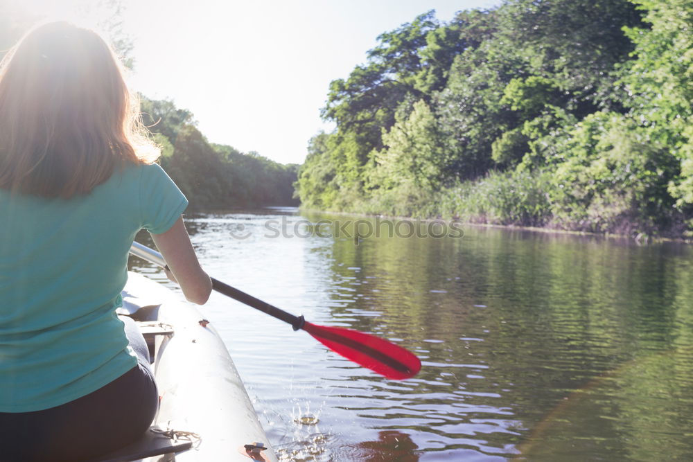 Similar – Unrecognizable woman on kayak exploring river