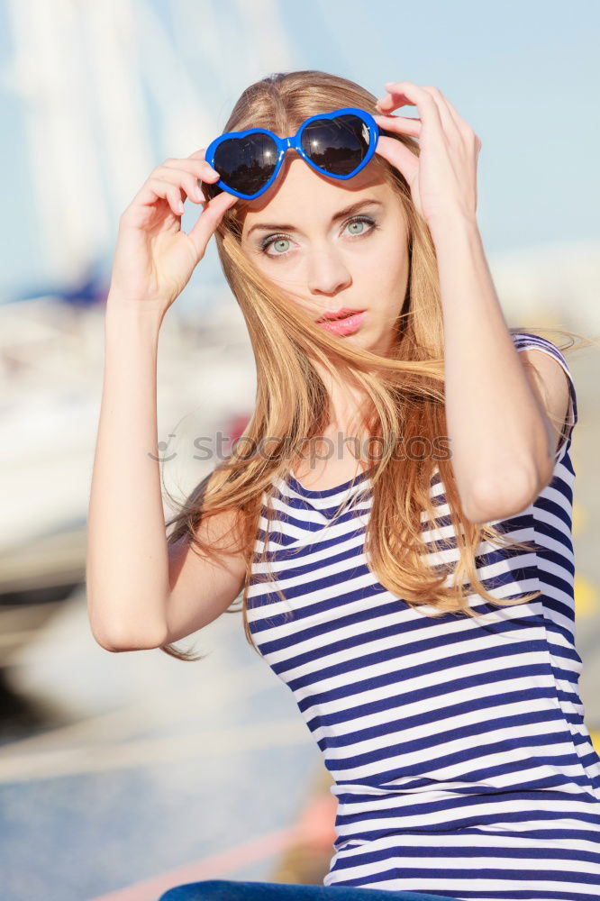 Image, Stock Photo Young girl sitting on jetty over the lake and dipping feet in water on sunny day in the summertime