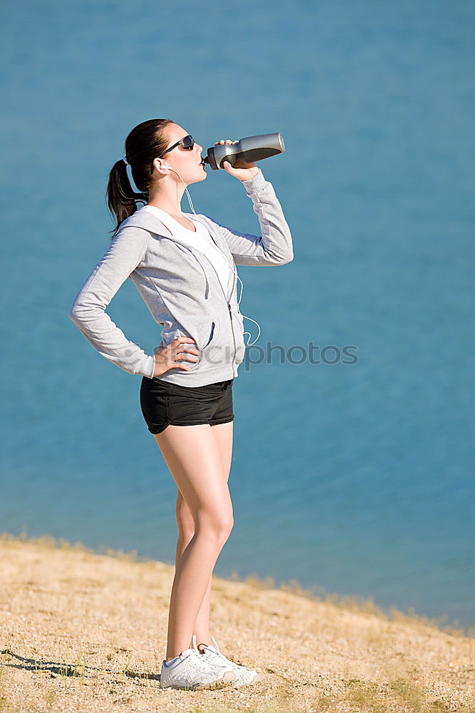 Similar – athletic woman resting and drinking