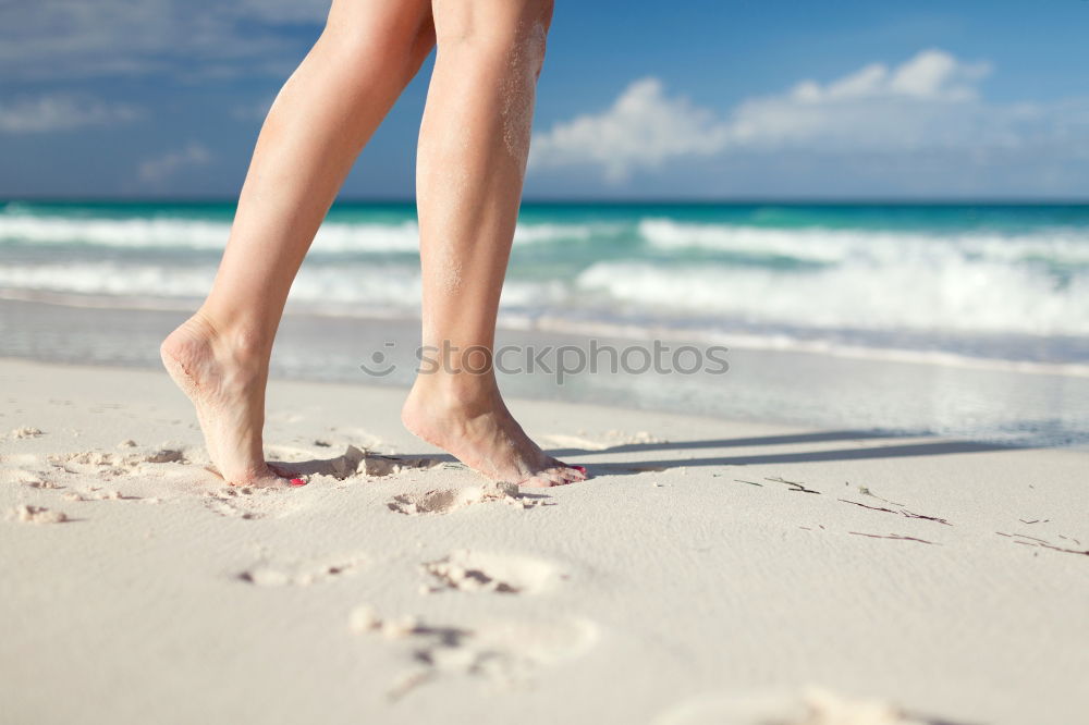 Similar – man takes a beach walk