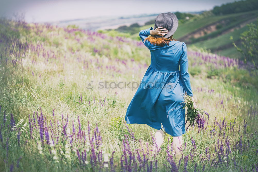 Similar – Happy young black woman surrounded by flowers