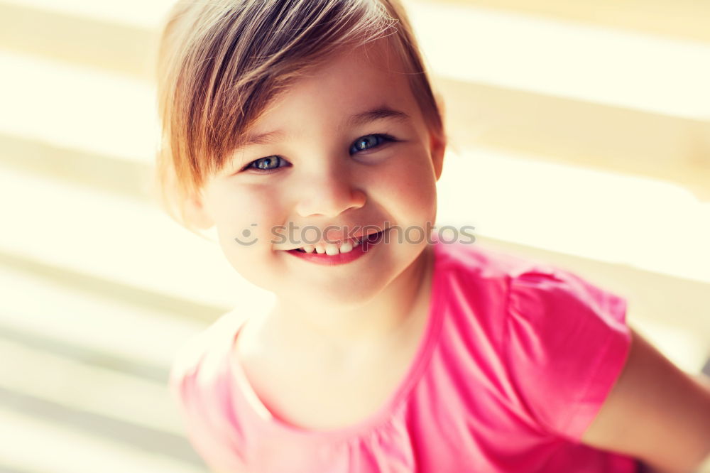 Similar – Adorable little girl with sweet smile lying down on bed.