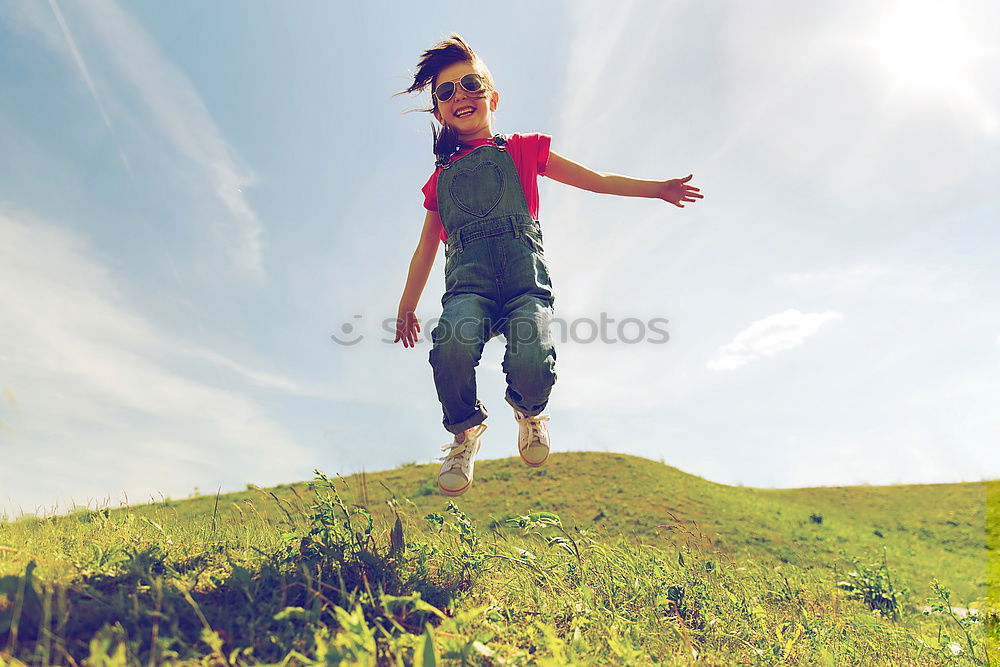 Similar – Low view of a happy redhead woman outdoors