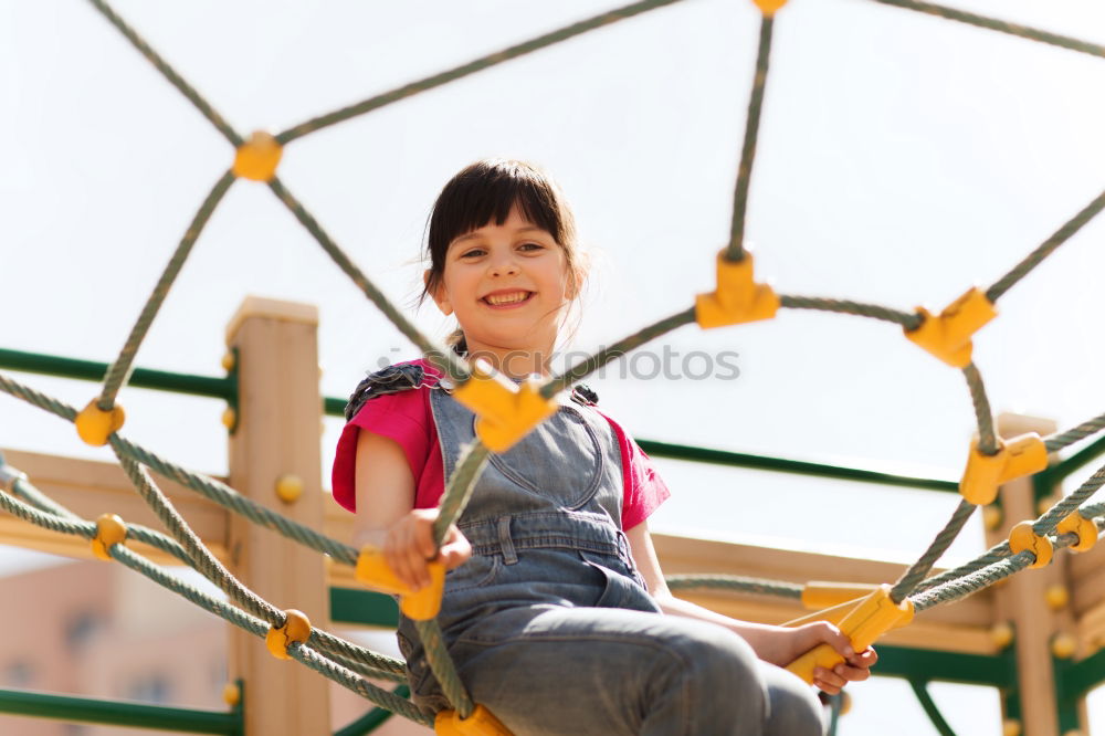 Similar – Image, Stock Photo Child climb a climbing wall