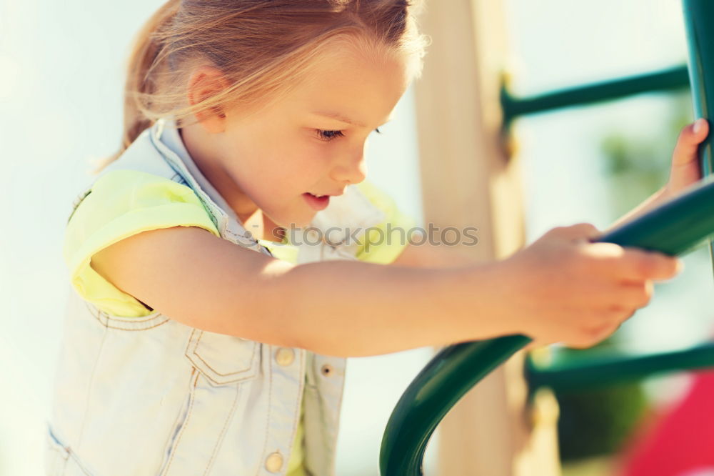 Similar – Young boy talking to the phone in a yellow telephone booth