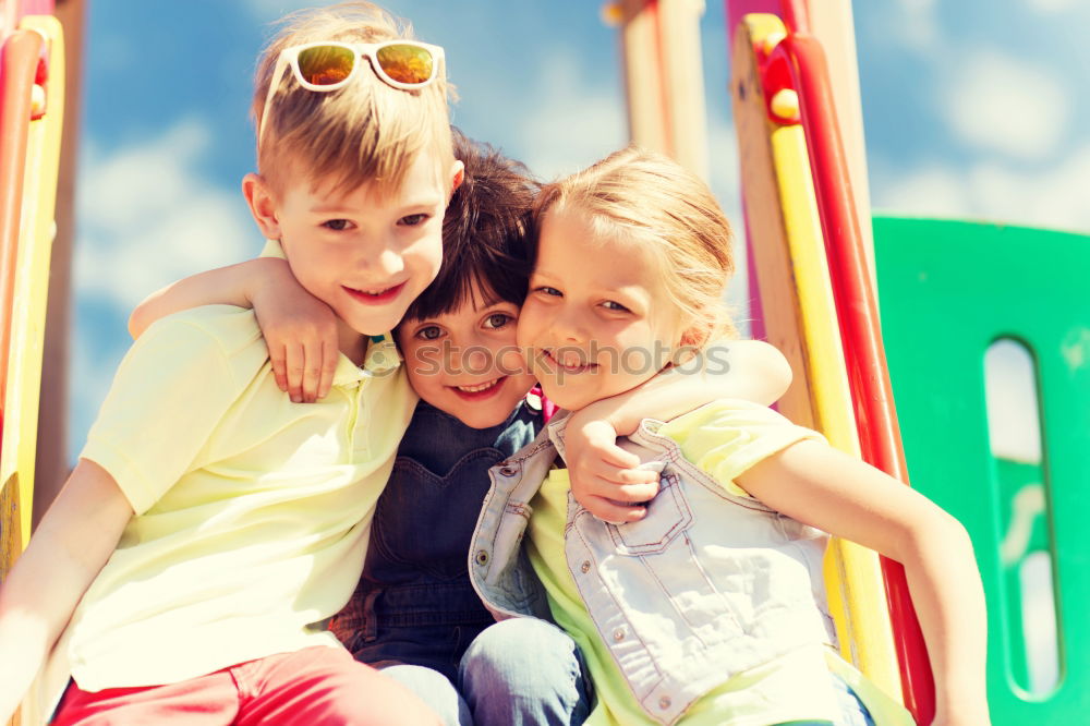 Similar – Image, Stock Photo Two happy children lie on a hammock and play with soap bubbles.