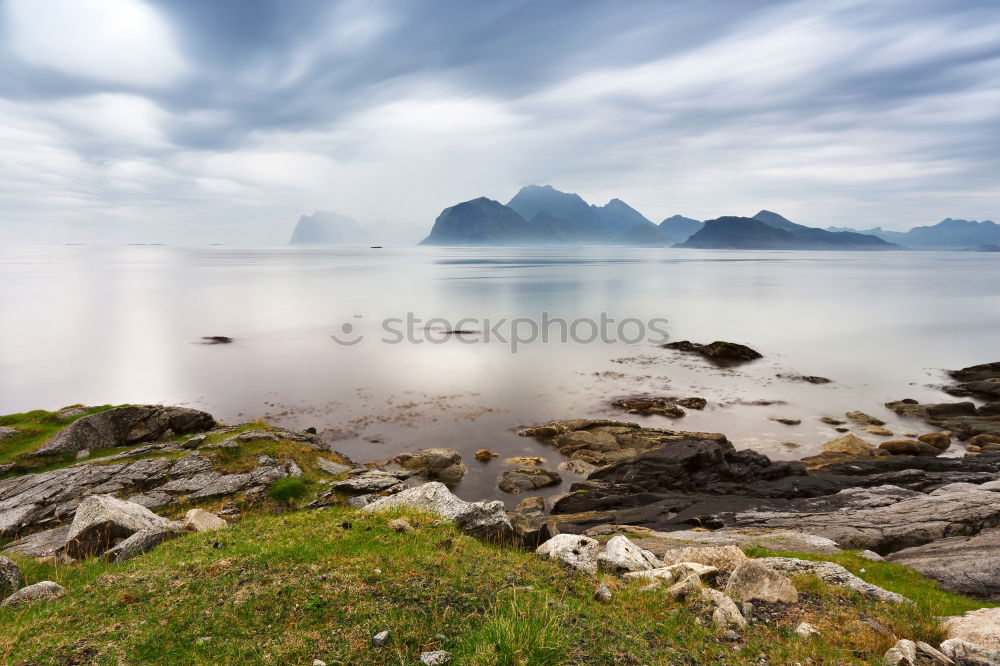 Summer cloudy Lofoten islands. Norway misty sea