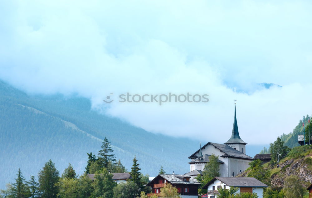 Similar – Church tower in front of foggy landscape