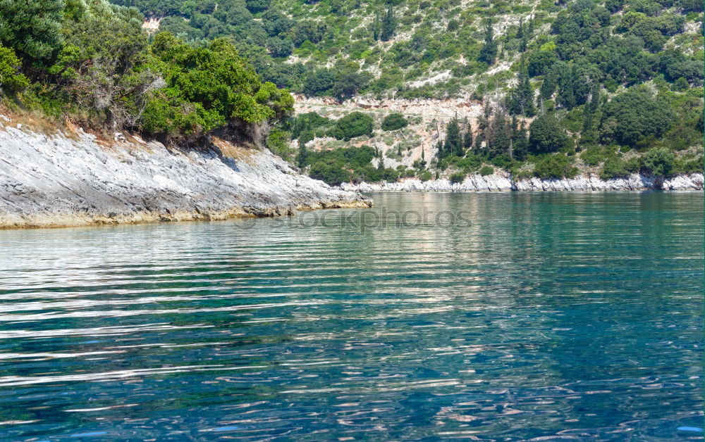 Similar – Urlaub und Erholung. Meer und Felsen. Blick vom Wasser. Idylle