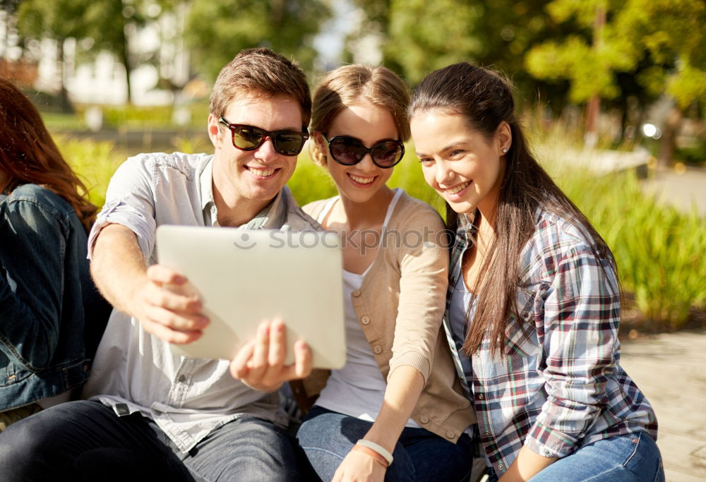 Similar – Multi-ethnic group of young people using smartphone