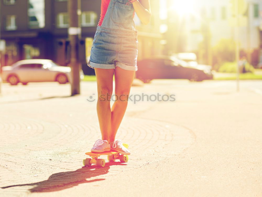 Similar – Man posing with skateboard in evening