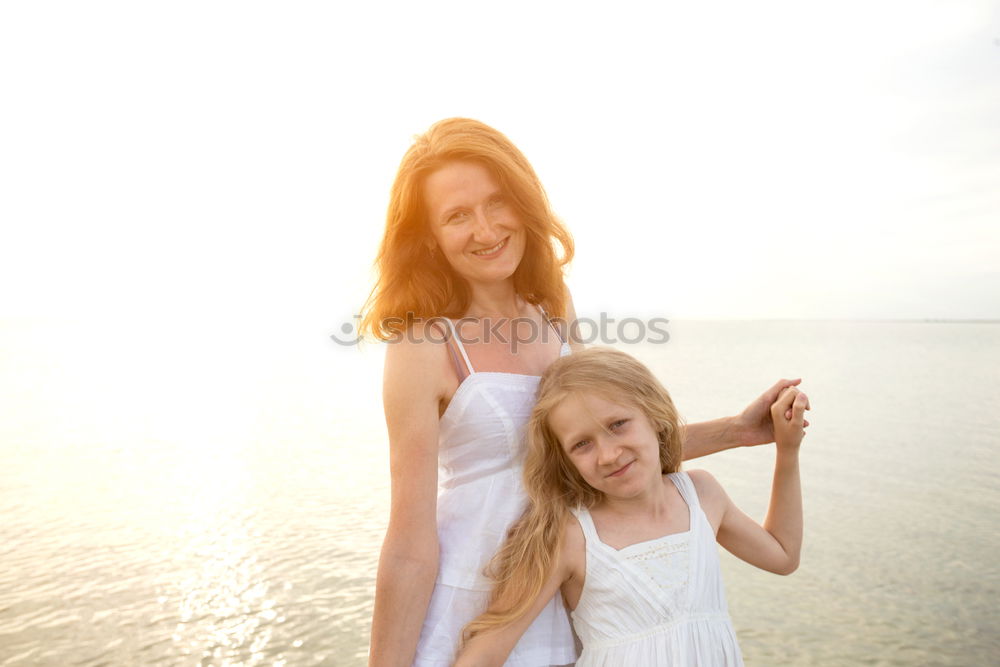 Similar – Image, Stock Photo caucasian mother having his son on her back at the beach