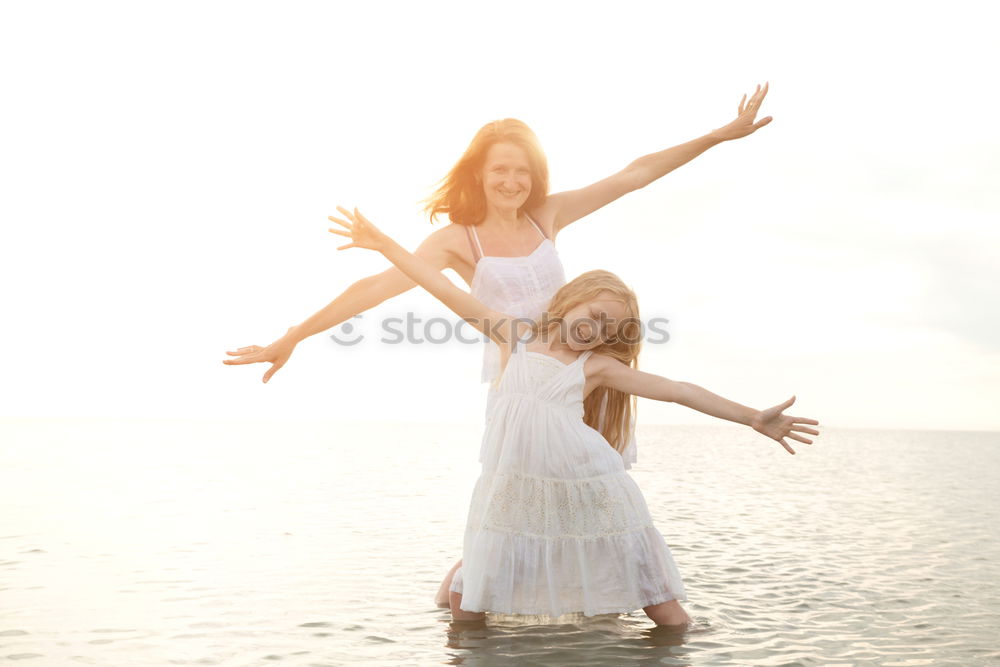 Similar – Image, Stock Photo Mother and son playing on the beach at the day time.