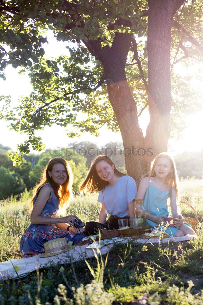 Similar – Image, Stock Photo Family spending vacation time together on a picnic