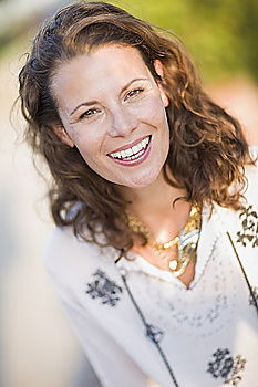 Similar – young beautiful redhead woman with curls and freckles smiles at camera