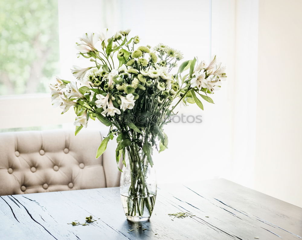 Similar – Image, Stock Photo Bouquet of flowers in a glass vase on the table in front of a window