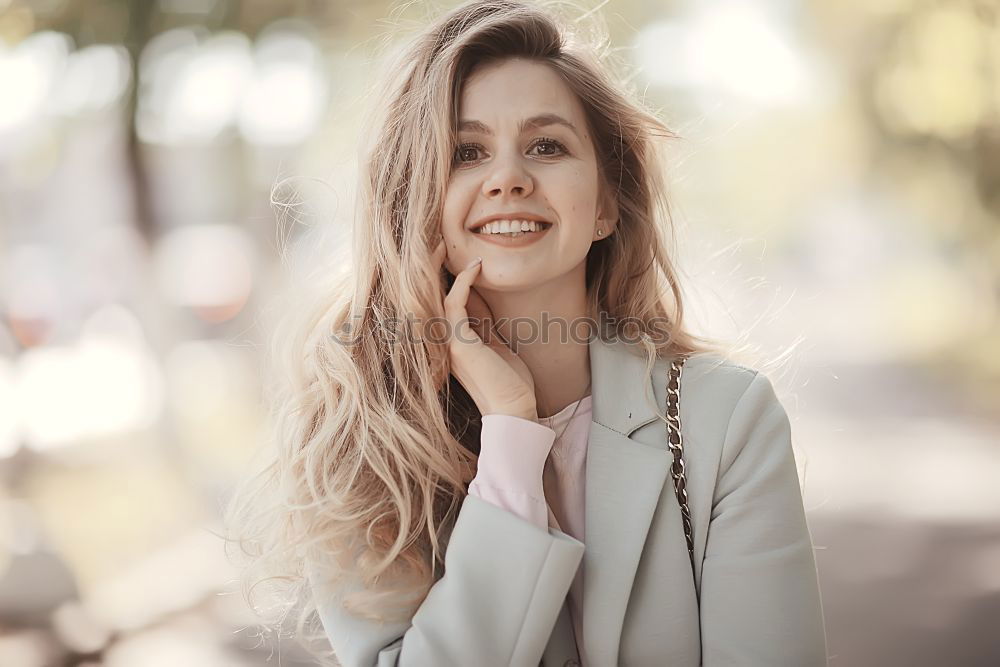 Similar – Beautiful young caucasian woman smiling outdoors