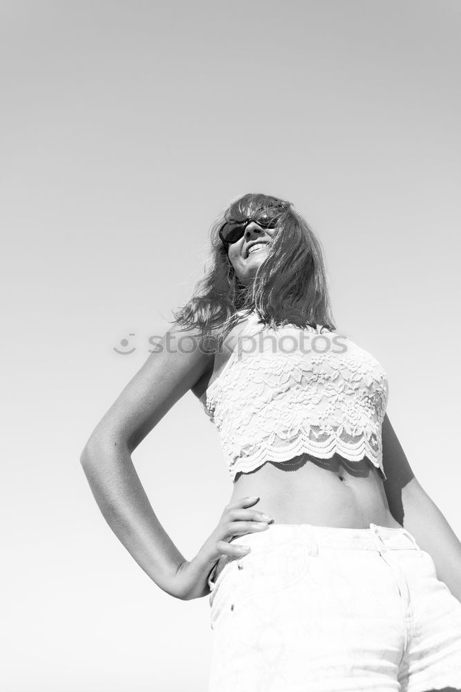 Similar – Young woman leaning on white wall