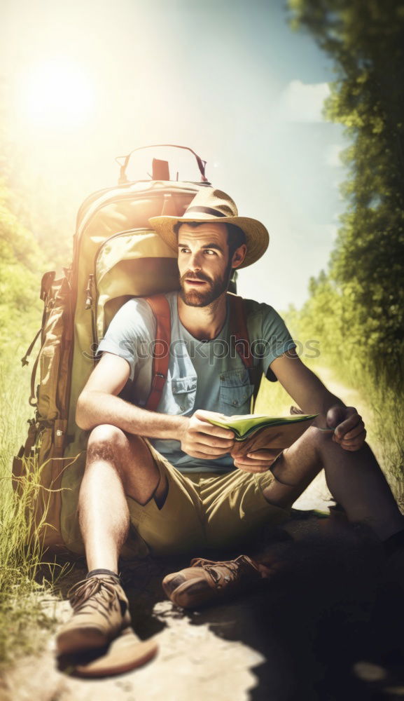 Similar – Man navigating on road in woods