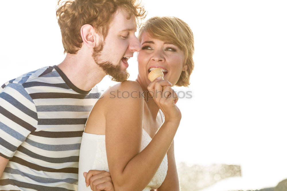 Similar – Cheerful couple having fun